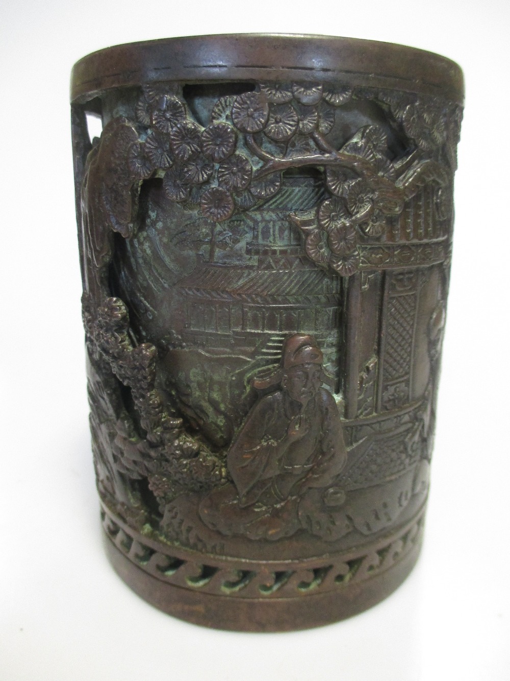 A Chinese copper relief cast cylindrical brush pot