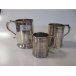 Three silver christening mugs, Sheffield 1915, London 1872, London 1808, gross weight 14.7ozt (3)