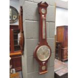 A mahogany wheel barometer by Negretti and Zambra, and a carved walnut wheel barometer (2)