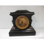 A slate mantel clock by Ansonia dated 1882, 28cm high