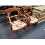 A pair of 19th century elm panel seat elbow dining chairs on turned legs (2)