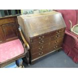 A George III oak bureau of classic design, 92cm wide