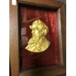 DICKENS (Charles) A commemorative gilt mounted profile bust of Charles Dickens, in oak frame 30 x
