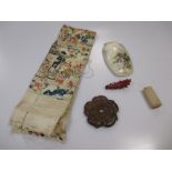 A box containing a seal, embroidery, mother of pearl etc Embroidery tatty and fraying Seal knocked