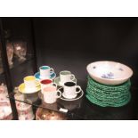 A set of six Susie Cooper coffee cans and saucers, leaf moulded green glazed Wedgwood plates and a