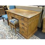 A modern pine pedestal desk on plinth base with a pine stool on turned legs, (2) 77 x 126 x 63cm