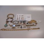 A collection of gold and costume jewellery including a diamond ring, a gold rope chain, a gold and