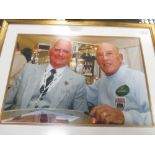 A signed photograph of Sterling Moss; A Graham Hill Scrapbook, signed and a signed Sterling Moss