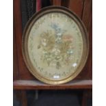 An early 19th century oval silkwork picture and two Chinese silkwork pictures (3)