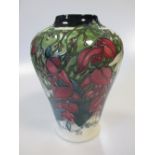 A modern Moorcroft 'Nostalgia' patern vase, no 104/150, boxed 22cm high