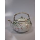 A first period Belleek grass pattern teapot and cover