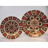 A set of ten Royal Crown Derby 1128 pattern dinner plates and three side plates