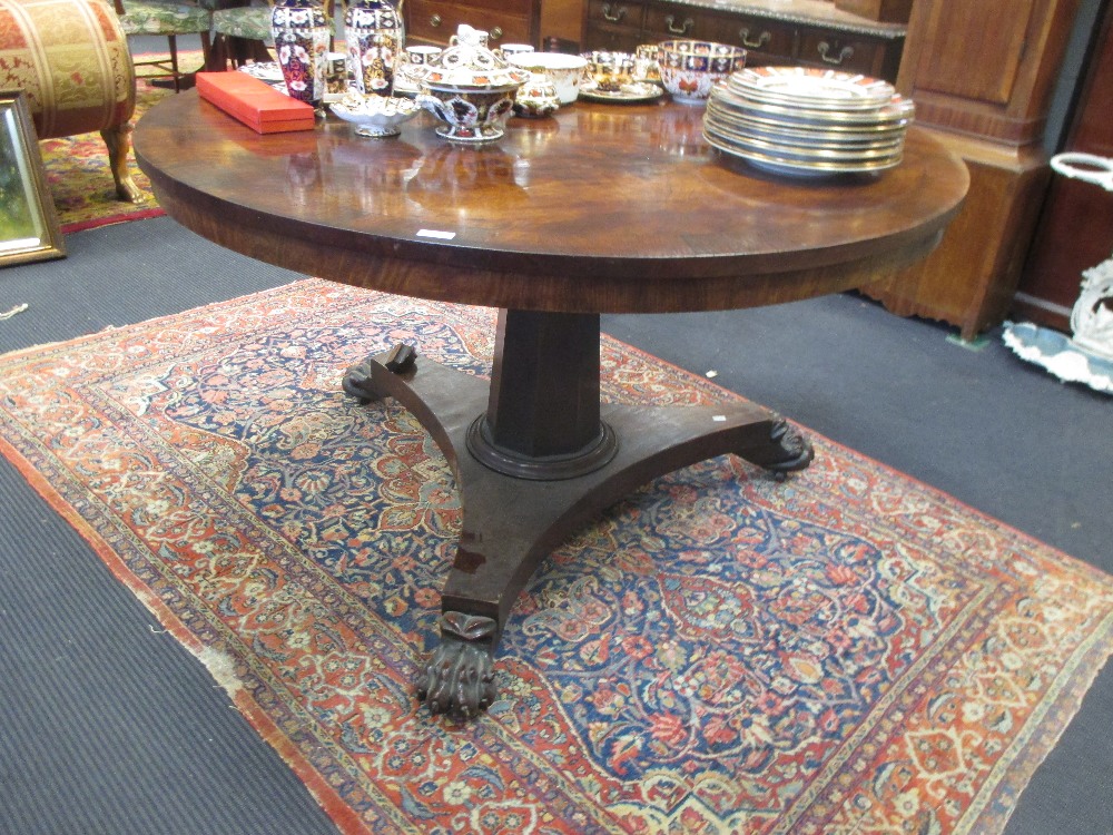 A William IV mahogany breakfast table with lion paw feet, 72 x 120cm
