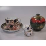 Two Crown Derby paperweights, a Derby Imari cup and saucer, a Doulton vase and a Perthshire