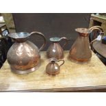 A collection of 9 copper jugs and a copper coal scuttle (10)