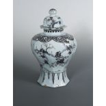 An Delft vase and cover, circa 1710, of hexagonal baluster form, painted in manganese in the Chinese