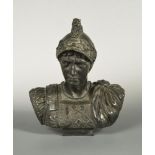 A bronze bust of a Roman Centurion, wearing a lion crested helmet with laurel wreath decoration,