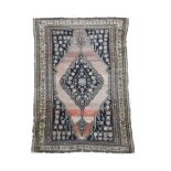 An Afshar rug with central indigo medallion and spandrels 203 x 122cm (79 x 48in) Faded with