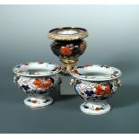 A rare pair of Mason's 'Japan Fence' pattern two handled pedestal salts, circa 1815, with shouldered