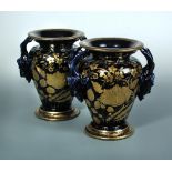 A pair of Mason's mazarin two handled vases, circa 1820 - 1830, typically decorated in gilt with