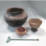 Three medieval earthenware vessels, to include a pedestal bowl, 10cm (4in) high, small two handled