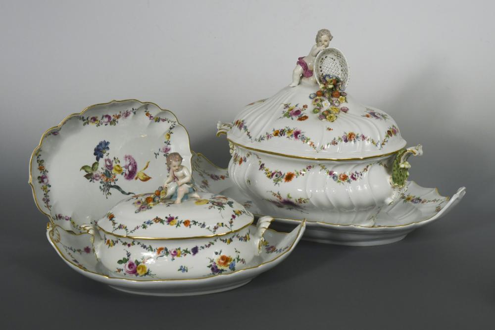 An 18th century Meissen composed dinner service, painted with Deutsche Blumen floral sprays, the