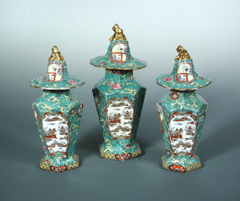 A Mason's garniture of three vases and covers, circa 1820, of tapering hexagonal form, printed and