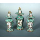 A Mason's garniture of three vases and covers, circa 1820, of tapering hexagonal form, printed and