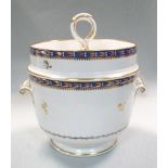 A Derby two handled ice pail and cover, circa 1795, with blue ground borders gilt with leaves,