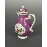 An 18th century Meissen purple ground milk jug and cover, circa 1740, the body reserved with two