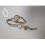 Two 9ct gold lady's watches, one on a gold bracelet, the other on a gold plated bracelet,