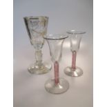 A pair of short stemmed drinking glasses and another drinking glass (3)