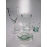 A quantity of green recycled glass to include a water jug, water glasses, shot glasses and wine