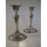 A pair of Victorian silver dwarf candlesticks, by Thomas Bradbury & sons, London 1898, loaded