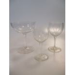 A set of fourteen champagne glasses, engraved with the family crest of the Dalison family