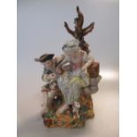 A Meissen style figural group of a courting couple embracing, 20cm high; two German porcelain