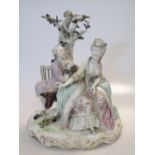 A German porcelain figural group depicting a courting couple seated on a bench, on a gilt scrolled