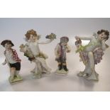 A pair of Meissen figures of winged cherubs and a pair of small Berlin figures, 'Martius' and '