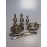 Four silver dishes, a napkin ring, two butter knives and three pepperettes (10)