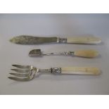 A Victorian silver and ivory handled pair of fish servers, and a stilton scoop with silver collar (