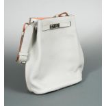 Hermès, Paris, a 'So Kelly 22' shoulder bag, 2014, the pearl grey bag with crevette pink interior,