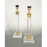 A near pair of 20th century gilt mounted acrylic table lamps, each of columnar form raised on