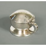 Liberty & Co., a silver mustard, Birmingham 1925, the spot hammered body with hinged cover and