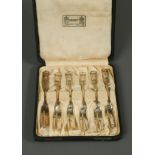 Liberty & Co., a cased set of six silver cake forks, Birmingham 1931, cast in the Honesty pattern,