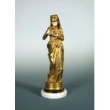 Albert Ernest Carrier-Belleuse (French, 1824-1887), Liseuse, a gilt bronze and ivory figure,