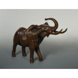 § Mark Stoddart (British, 20th century), Bull Elephant, bronze, modelled spraying water over itself,