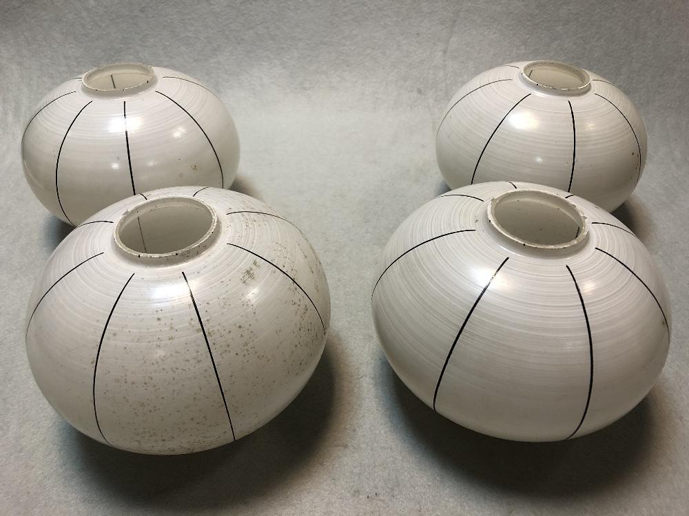 A set of four Art Deco hand-painted glass light shades, of compressed spherical form with black line