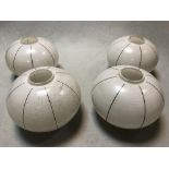 A set of four Art Deco hand-painted glass light shades, of compressed spherical form with black line