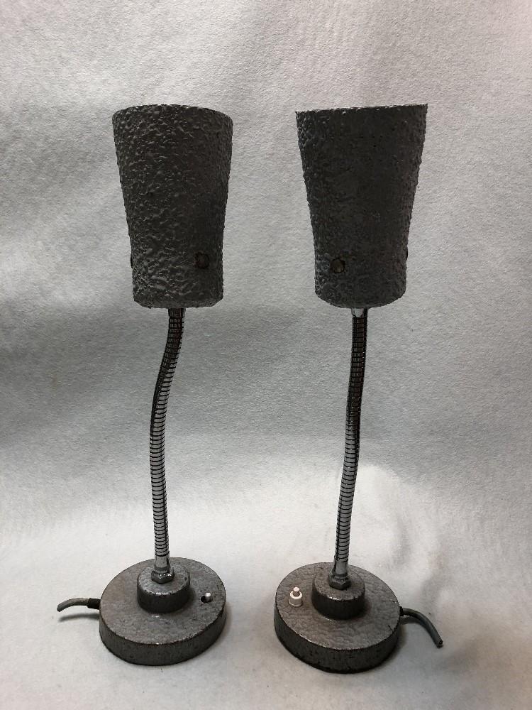 A pair of 20th century industrial table lamps, with textured grey shades on flexible uprights and