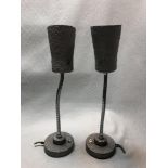 A pair of 20th century industrial table lamps, with textured grey shades on flexible uprights and